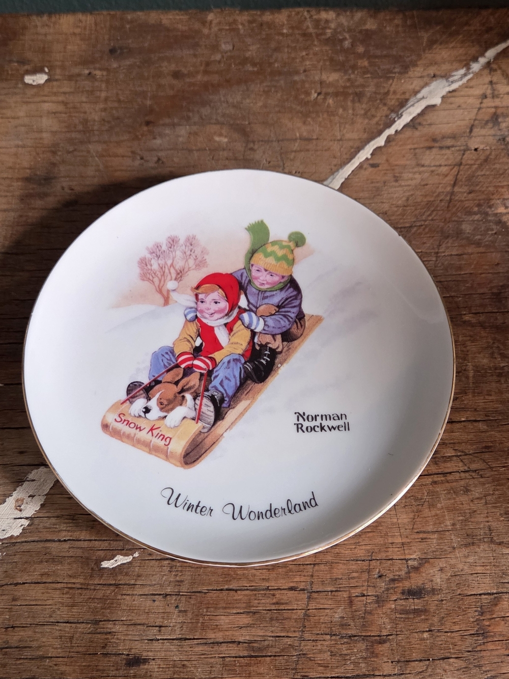 Norman Rockwell Decorative Plate Featuring Red, Green, Yellow Accents